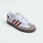 Emphasising the low-profile casual silhouette and the professional alignment of the rich red heel tabs.