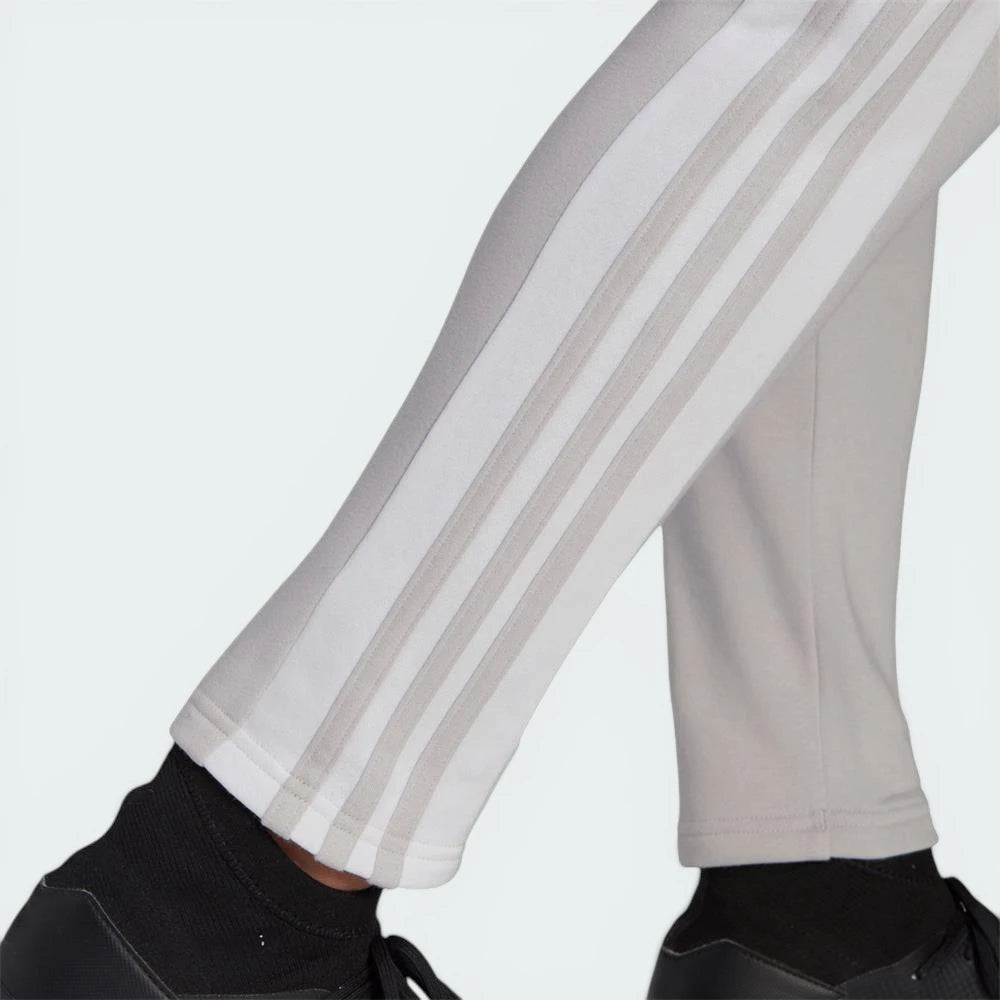 Zoom looking at the open hem cuffs and 3 stripes design