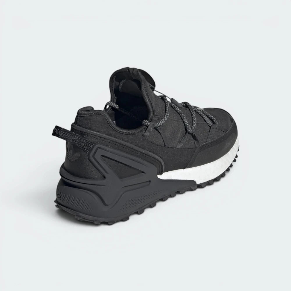 Focuses on the Boost midsole and the professional finish of the Gore-Tex branding.