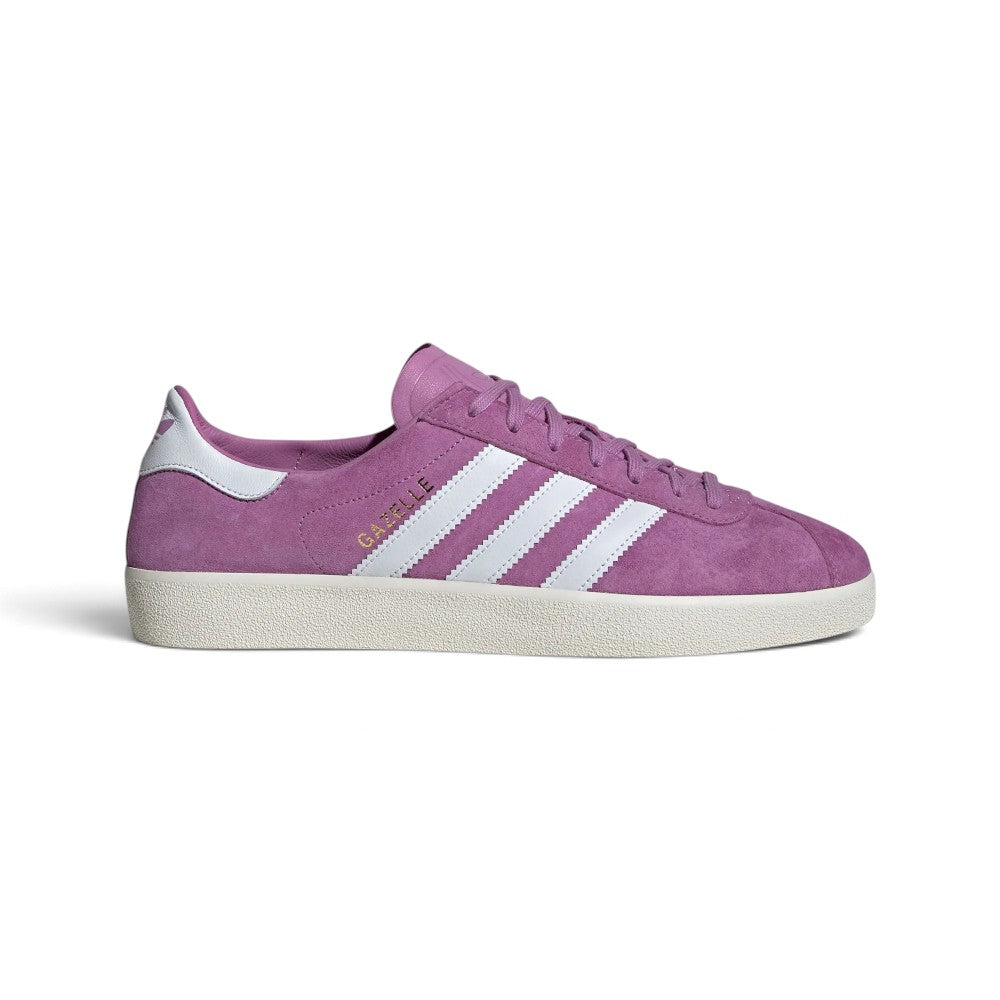 Highlights the sleek, collapsed low-profile lateral silhouette featuring the rich Preloved Purple deconstructed suede upper, crisp Cloud White leather serrated 3-Stripes, metallic gold foil "GAZELLE" lettering, matching white heel tab, and off-white/gum rubber cupsole.