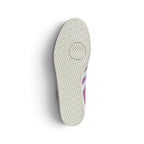 Displays the full-length textured rubber outsole, showcasing the iconic micro-hexagon Gazelle suction tread pattern, pivot points, and debossed adidas Trefoil branding in the arch recess.