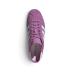 Focuses on the locked-in central lacing layout, displaying flat Preloved Purple laces, thin unstructured suede tongues, reinforced T-toe overlays, and smooth white leather insoles stamped with gold foil adidas branding.