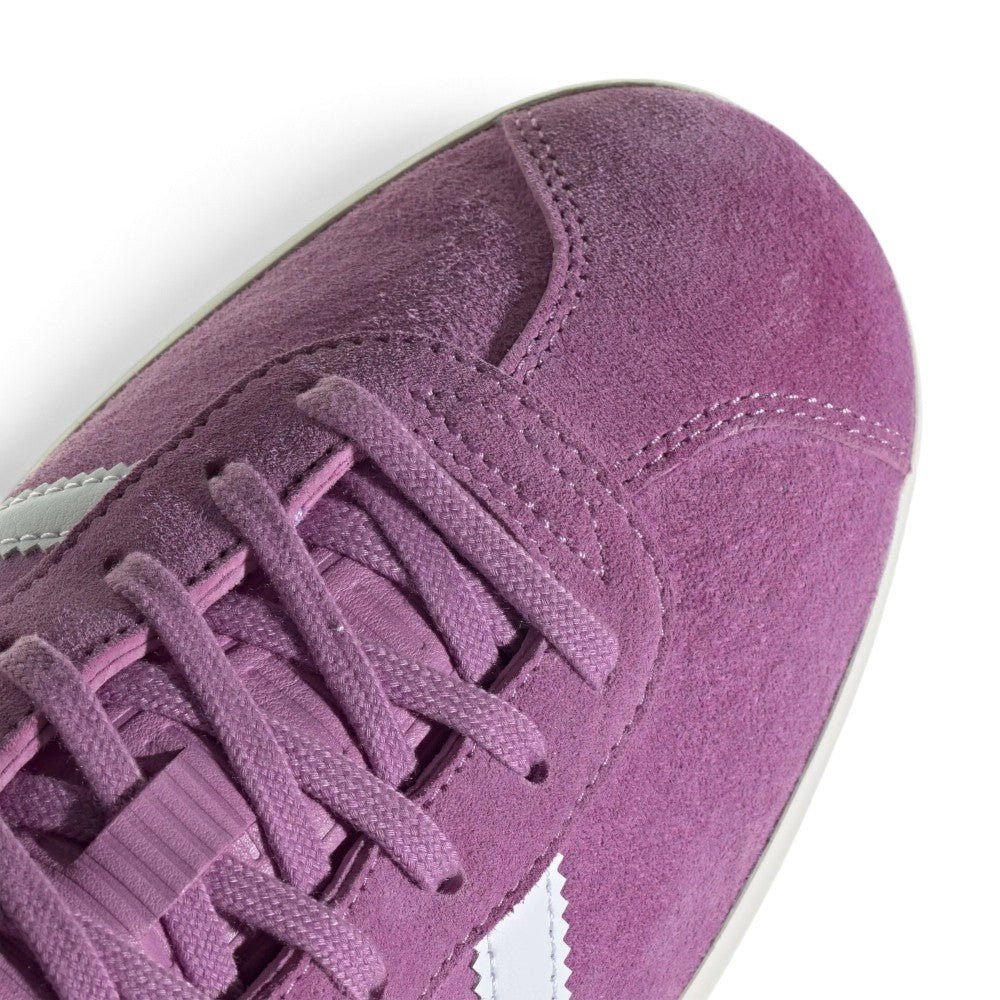 Details the micro-precision of the forefoot area, showing the buttery nap of the Preloved Purple suede T-toe mudguard, flat woven laces, and supple unpadded tongue construction.