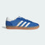 Side Profile Image: The Blue and Power Blue Gazelle Indoor Pro, highlighting the translucent wrapped sole and the white serrated 3-Stripes.