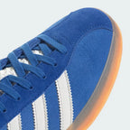Zoom Looking at the Front of the Shoes and Laces: A close-up of the fine suede grain and the precision stitching on the toe box.