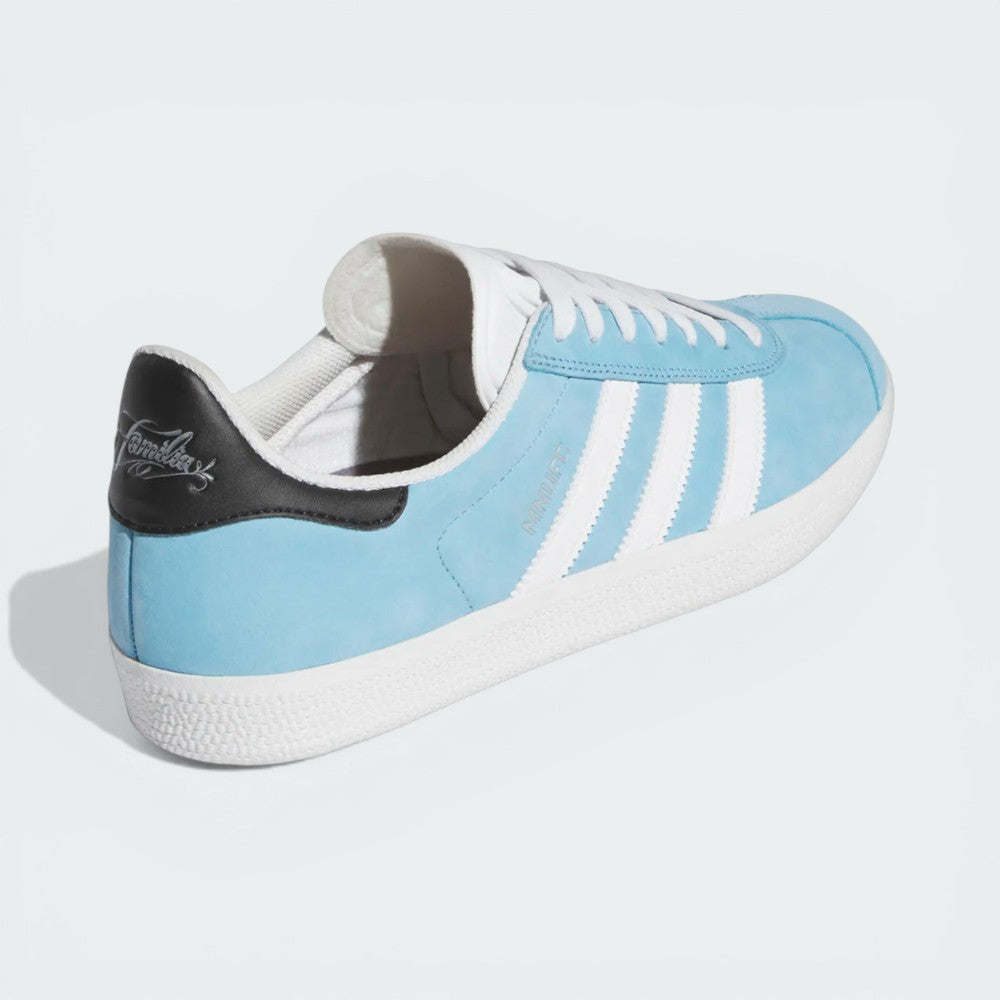 Focusing on the reinforced heel tab and the seamless transition into the vulcanized sole.