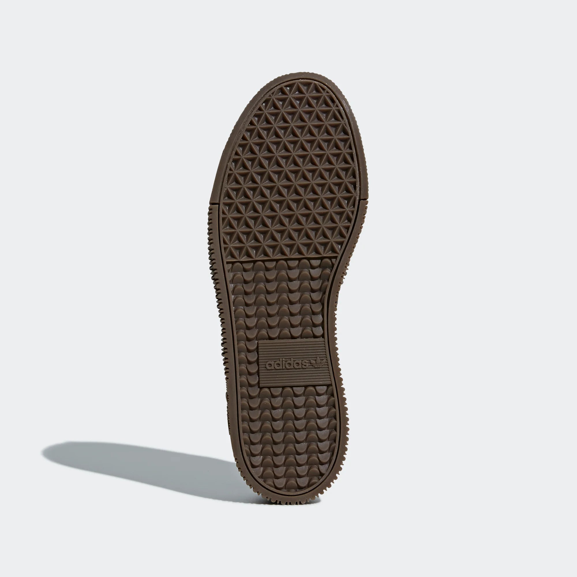Displays the classic pivot-point tread pattern in a rich gum rubber designed for unreal vintage grip.