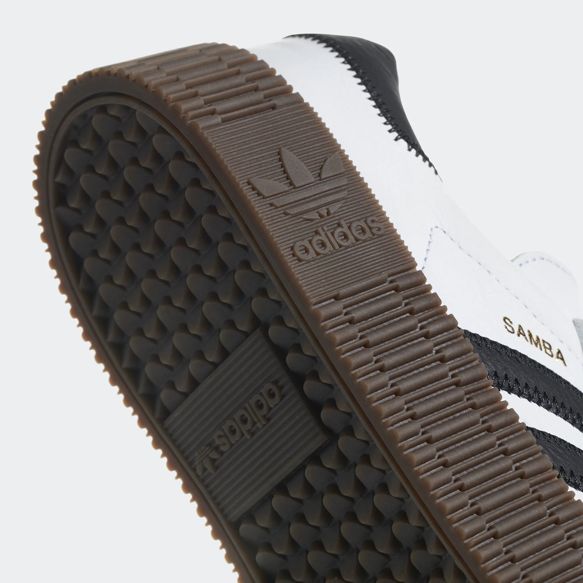 Highlights the technical textured sidewall of the platform and the "unreal" translucent quality of the gum rubber.