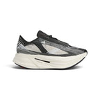 Studio side-profile shot of the adidas by Stella McCartney Prime x 2.0 STRUNG shoes in Cloud White, Grey One, and Core Black, highlighting the data-mapped STRUNG upper, stacked white midsole, Lightstrike Pro branding, and Continental rubber outsole.