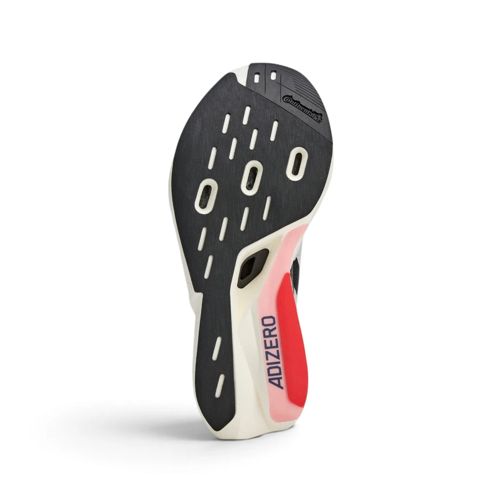 Bottom-down view of the Continental rubber outsole, revealing the high-traction grip pods, curved cutouts, and Adizero arch branding.