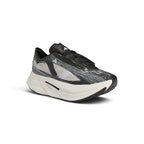 Angled front perspective emphasizing the aerodynamic toe box, intricate STRUNG thread patterns, and thick cushioning stack.
