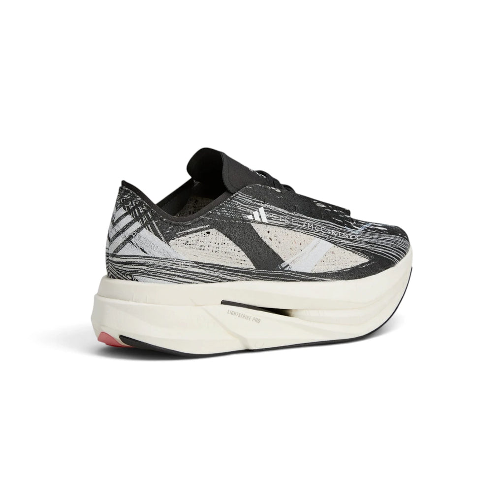 Rear-angle studio shot focusing on the sculpted heel geometry, contrasting pink heel accent, and ankle lockdown fit.