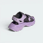 Focuses on the reinforced heel strap layout and the clean finish of the embossed adidas by Stella McCartney logo branding.