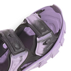 Details the high-definition textile weave of the forward straps and the clean finish of the open toe box design.