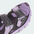 Details the high-definition textile weave of the forward straps and the clean finish of the open toe box design.