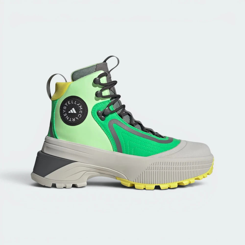 Highlights the high-velocity Solar Lime colour palette, the printed structural overlays, and the professional depth of the thick, rugged midsole.