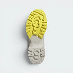 Displays the heavy-duty rubber outsole tread pattern engineered for unreal multi-surface traction on wet, rocky, or icy paths.
