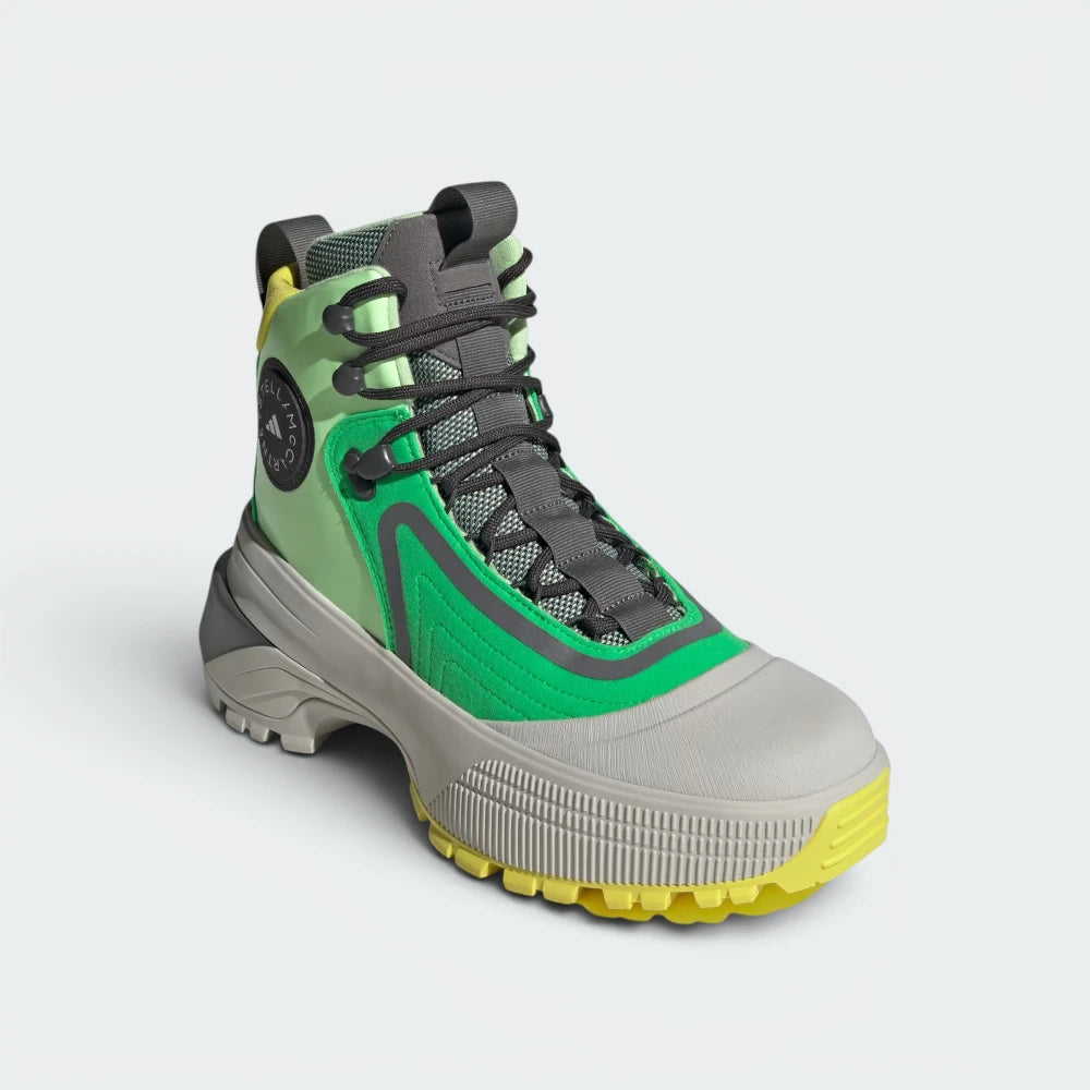 Emphasising the locked-in, high-top ankle architecture and the professional alignment of the prominent adidas by Stella McCartney logo.