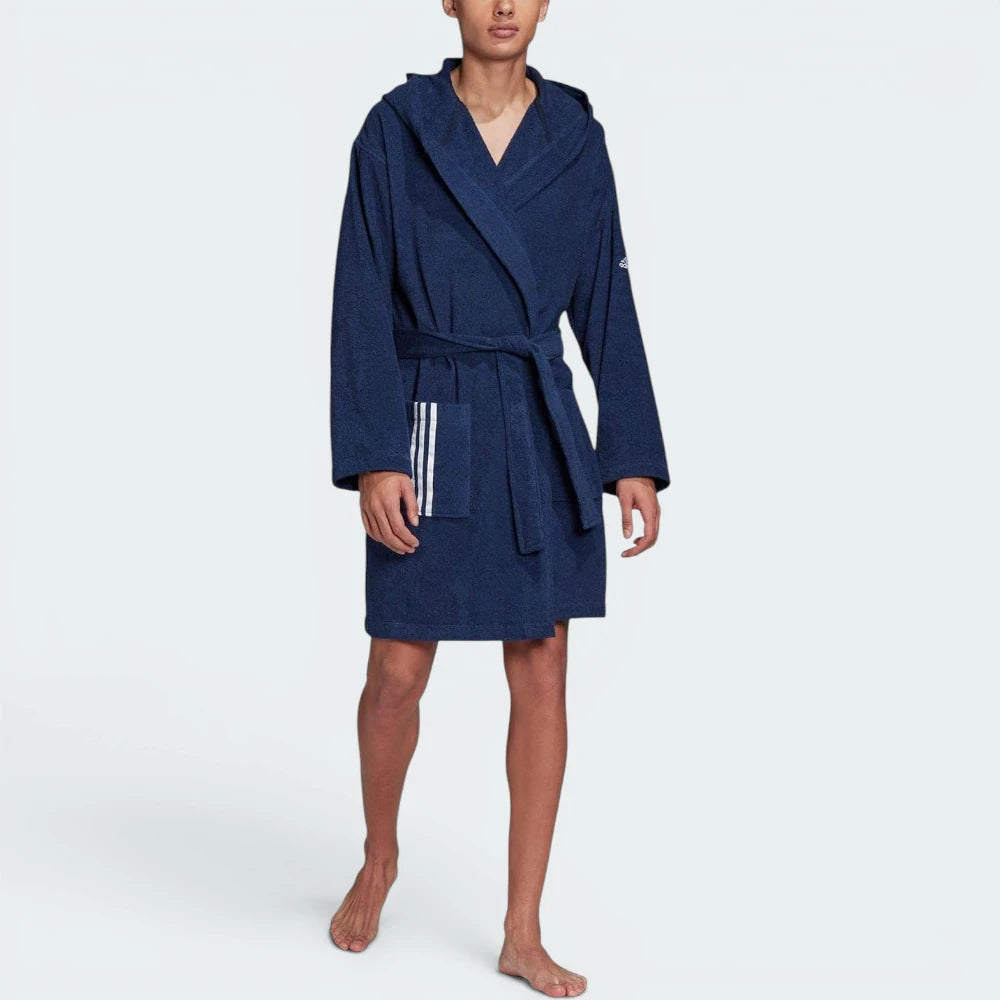 Highlights the clean hem stitching, the unique brand logo at the elbow, and the professional drape of the lightweight Indigo fabric.
