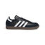 Studio lateral shot of the adidas Samba Leather Shoes in Core Black and Cloud White, highlighting the black full-grain leather upper, white serrated three stripes, gold foil SAMBA branding, suede T-toe overlay, and non-marking gum rubber outsole.