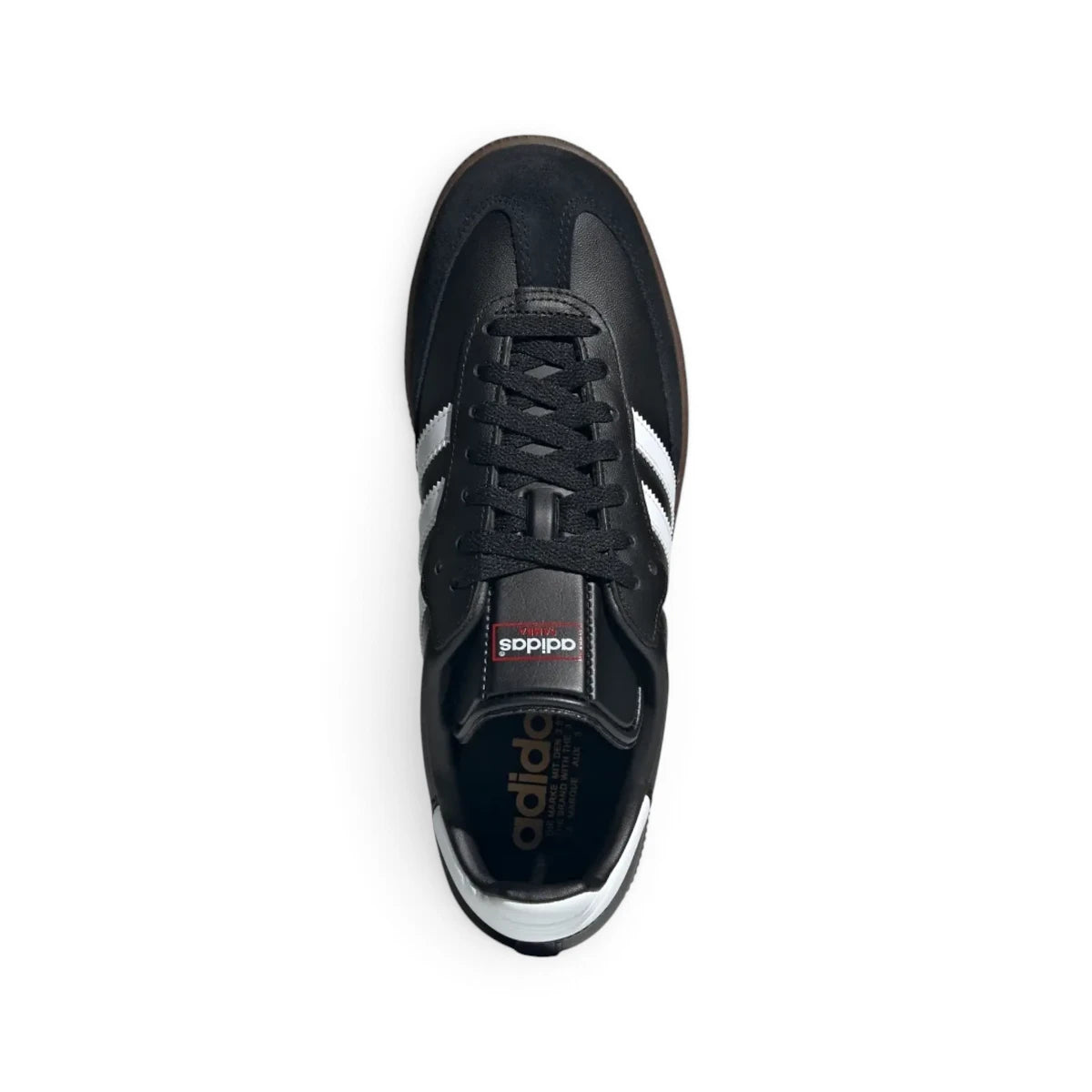 Overhead view looking down at the laced black shoes, displaying the black flat laces, elongated tongue structure featuring the classic adidas branding patch, and contrast interior lining.