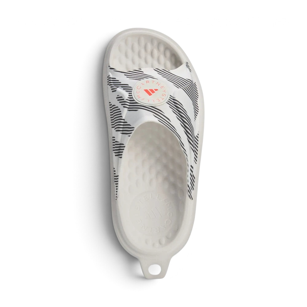 Focuses on the roomy, unrestrictive entry way and the high-definition placement of the crisp adidas by Stella McCartney logo text.