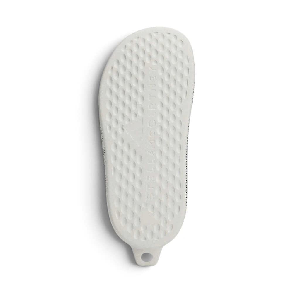 Displays the subtle, technical traction channels engineered for an unreal grip on indoor and outdoor surfaces.