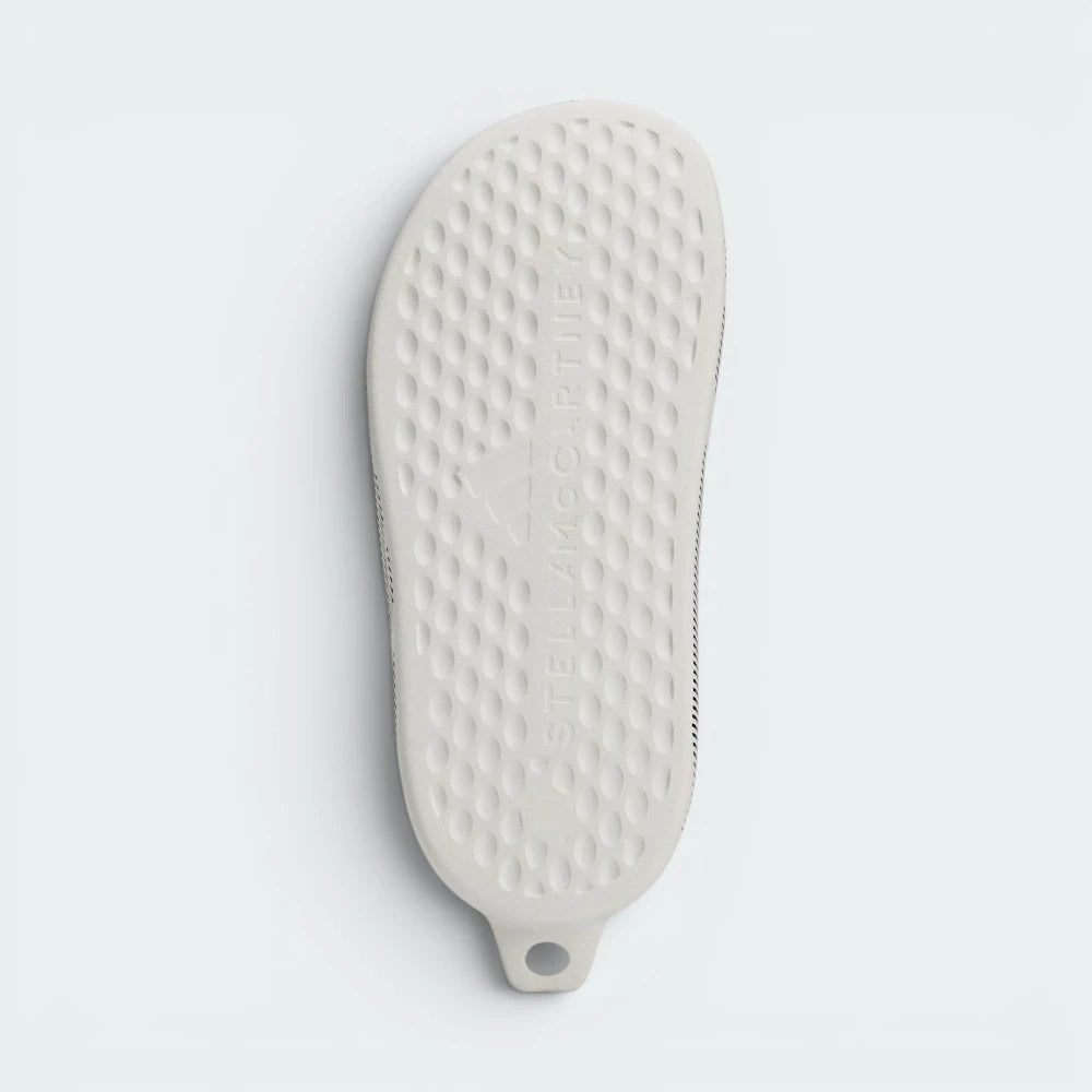 Displays the subtle, technical traction channels engineered for an unreal grip on indoor and outdoor surfaces.