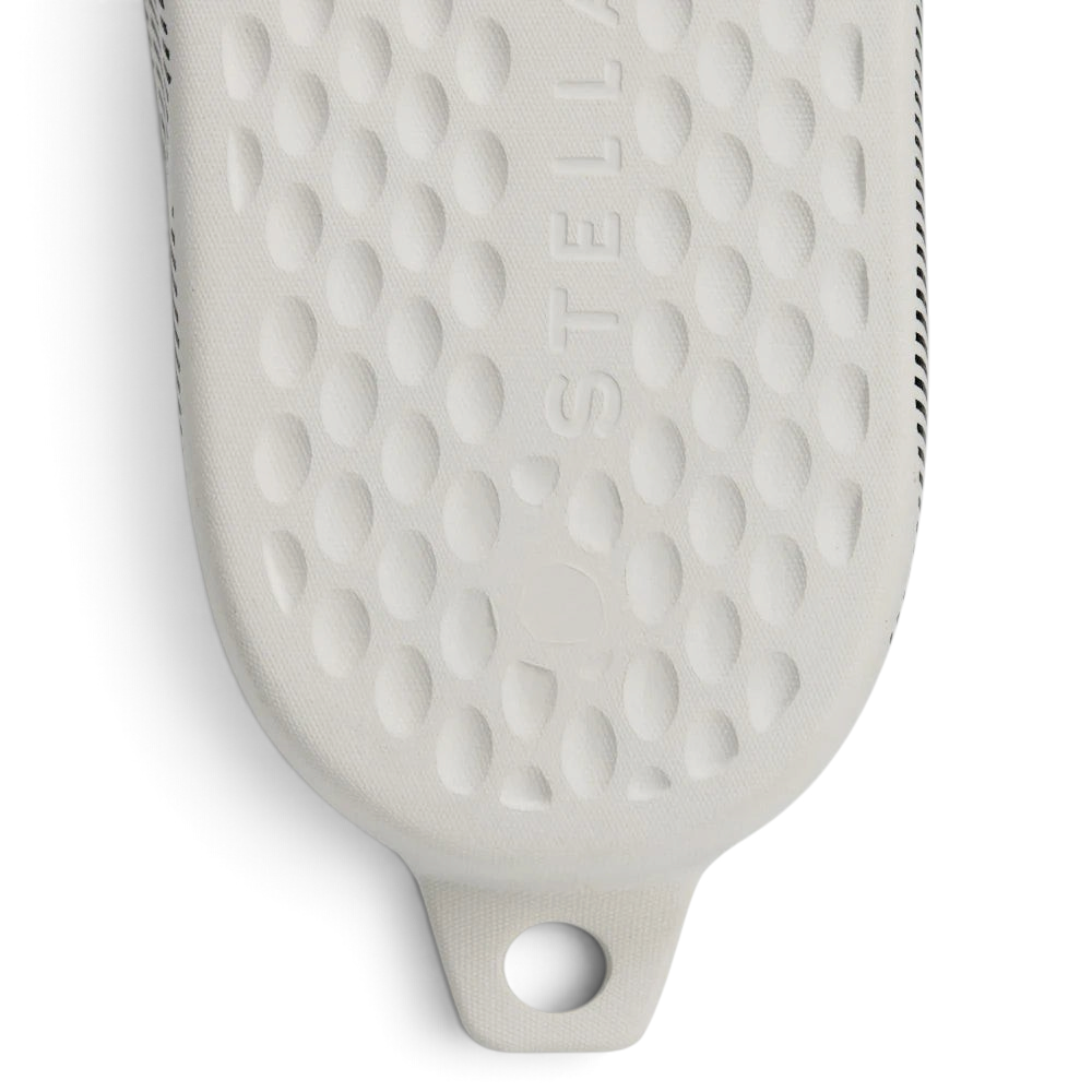 Highlights the "unreal" lightweight density of the synthetic midsole and its stable, single-unit integration.