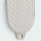Highlights the "unreal" lightweight density of the synthetic midsole and its stable, single-unit integration.