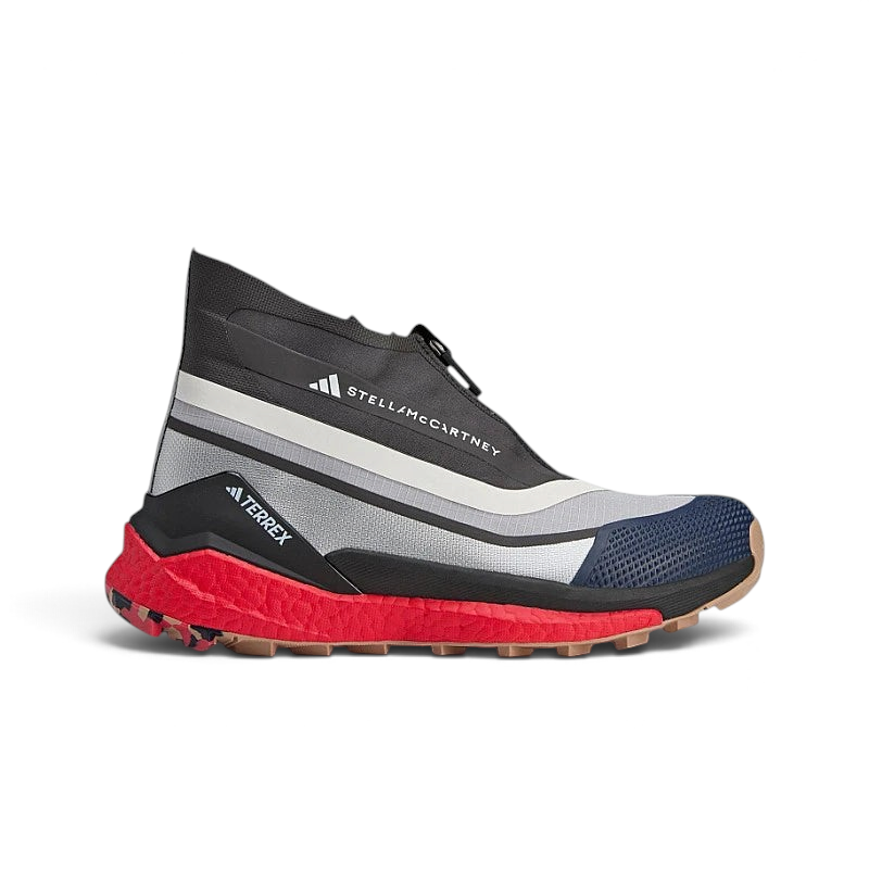 Highlights the high-velocity silver metallic design overlays and the professional contrast of the vibrant Red Boost midsole wall.