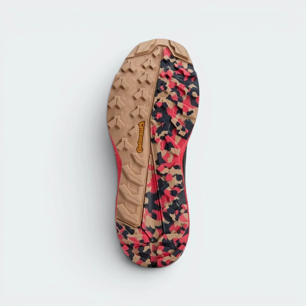 Displays the technical Continental™ Rubber tread matrix showcasing its rugged camo design outsole built for unreal trail traction.