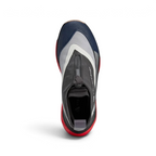 Focuses on the locked-in entry collar and the clean layout of the Black/White/Cream waterproof upper.