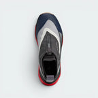 Focuses on the locked-in entry collar and the clean layout of the Black/White/Cream waterproof upper.