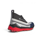 Focuses on the contoured rear ankle support structure and the premium finish of the Stella McCartney logo heel pull.