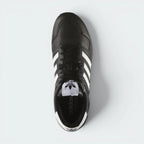 Focuses on the locked-in lacing system and the high-definition leather grain on the toe box.
