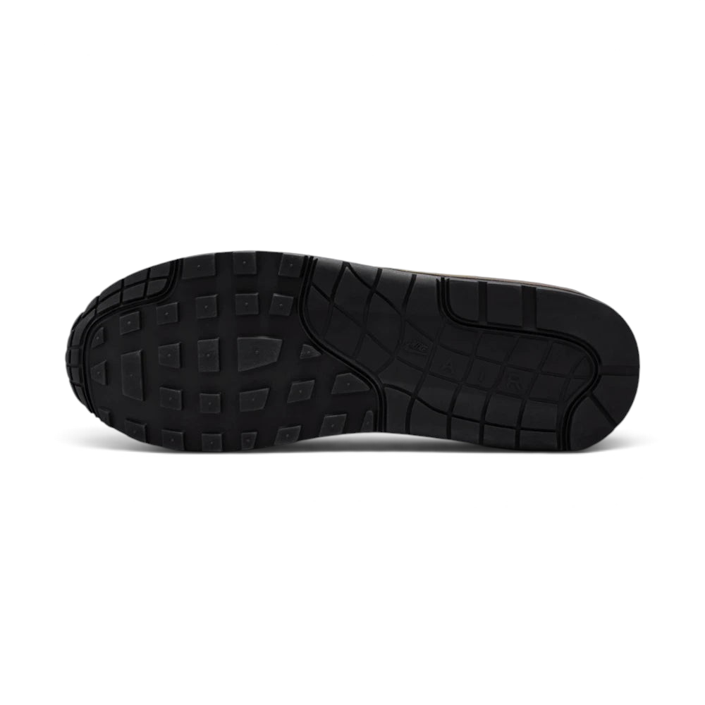 Displays the iconic waffle-tread pattern of the durable multi-tone rubber sole, showcasing the green, black, and white rubber blocks engineered for unreal everyday walking flexibility and grip.