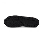 Displays the iconic waffle-tread pattern of the durable multi-tone rubber sole, showcasing the green, black, and white rubber blocks engineered for unreal everyday walking flexibility and grip.
