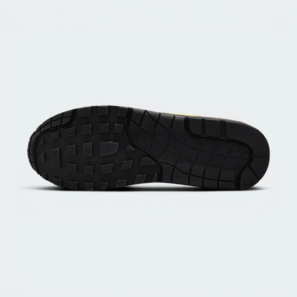 Displays the iconic waffle-tread pattern of the durable multi-tone rubber sole, showcasing the green, black, and white rubber blocks engineered for unreal everyday walking flexibility and grip.