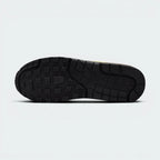 Displays the iconic waffle-tread pattern of the durable multi-tone rubber sole, showcasing the green, black, and white rubber blocks engineered for unreal everyday walking flexibility and grip.