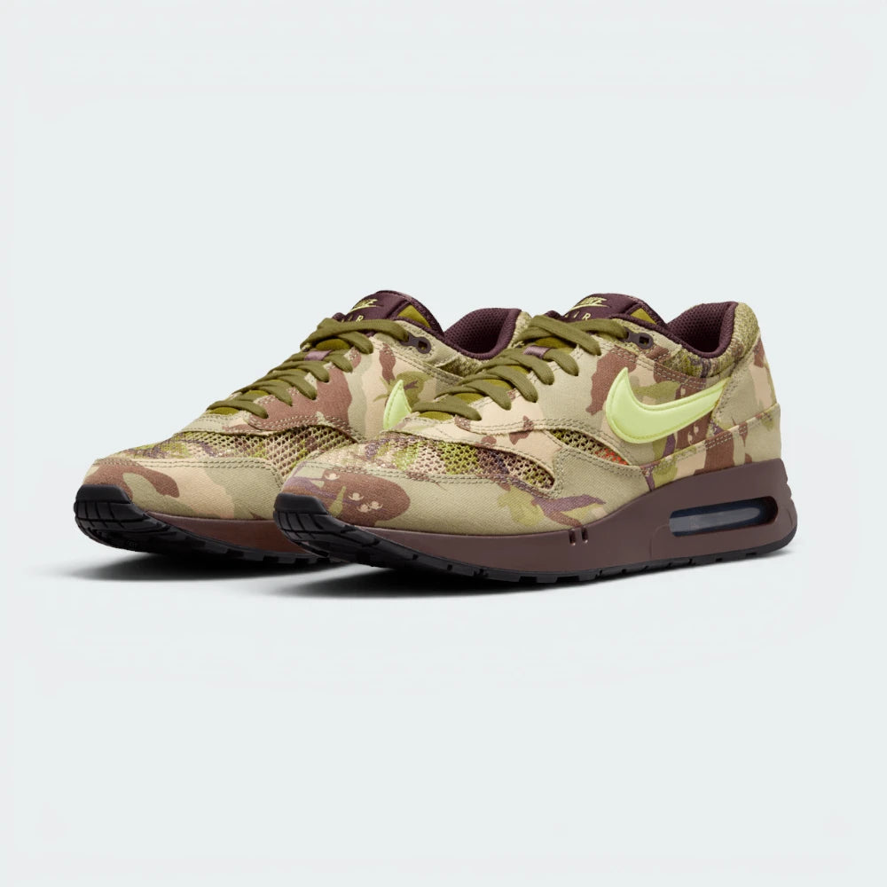 Emphasises the low-slung, forward-leaning athletic running stance and the professional harmony of the earth-tone green and brown panels.
