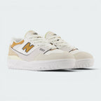 Emphasising the low-cut, athletic basketball stance of the trainers and the harmonious contrast between the smooth white leather, sea salt suede, and tobacco branding hits.