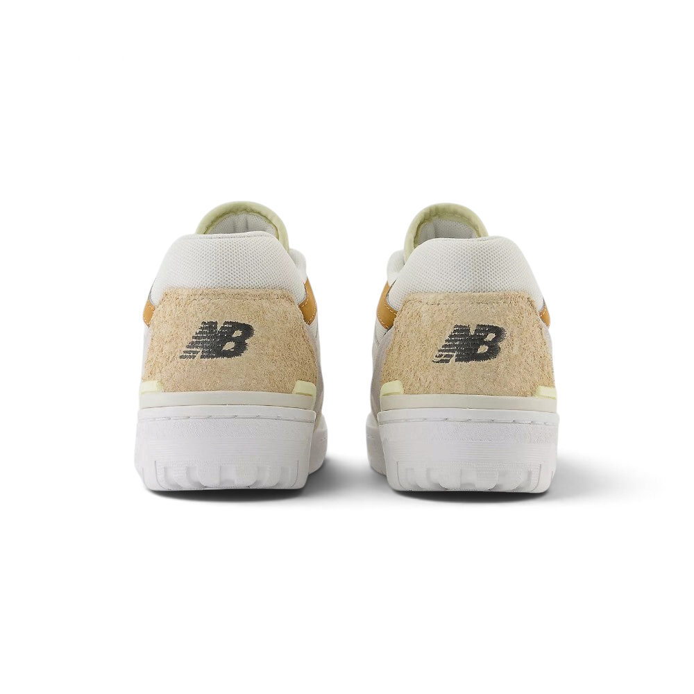 Focuses on the rear profile of both heels, highlighting the tactile hairy suede heel counters, black embroidered "NB" logos, and the sturdy white rubber sole base.