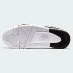 Displays the classic basketball herringbone tread pattern of the durable white and black rubber sole, showcasing the pivot circle grid engineered for unreal multi-surface street grip.