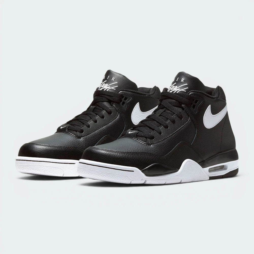 Emphasising the bold, forward-leaning basketball stance of the mid-tops and the professional harmony of the black leather uppers sitting cleanly above the white midsoles.