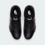 Focuses on the locked-in traditional lacing layout, displaying the perfect symmetry of the black leather tongue, matching black laces, and the white embroidered "Flight" logo script.