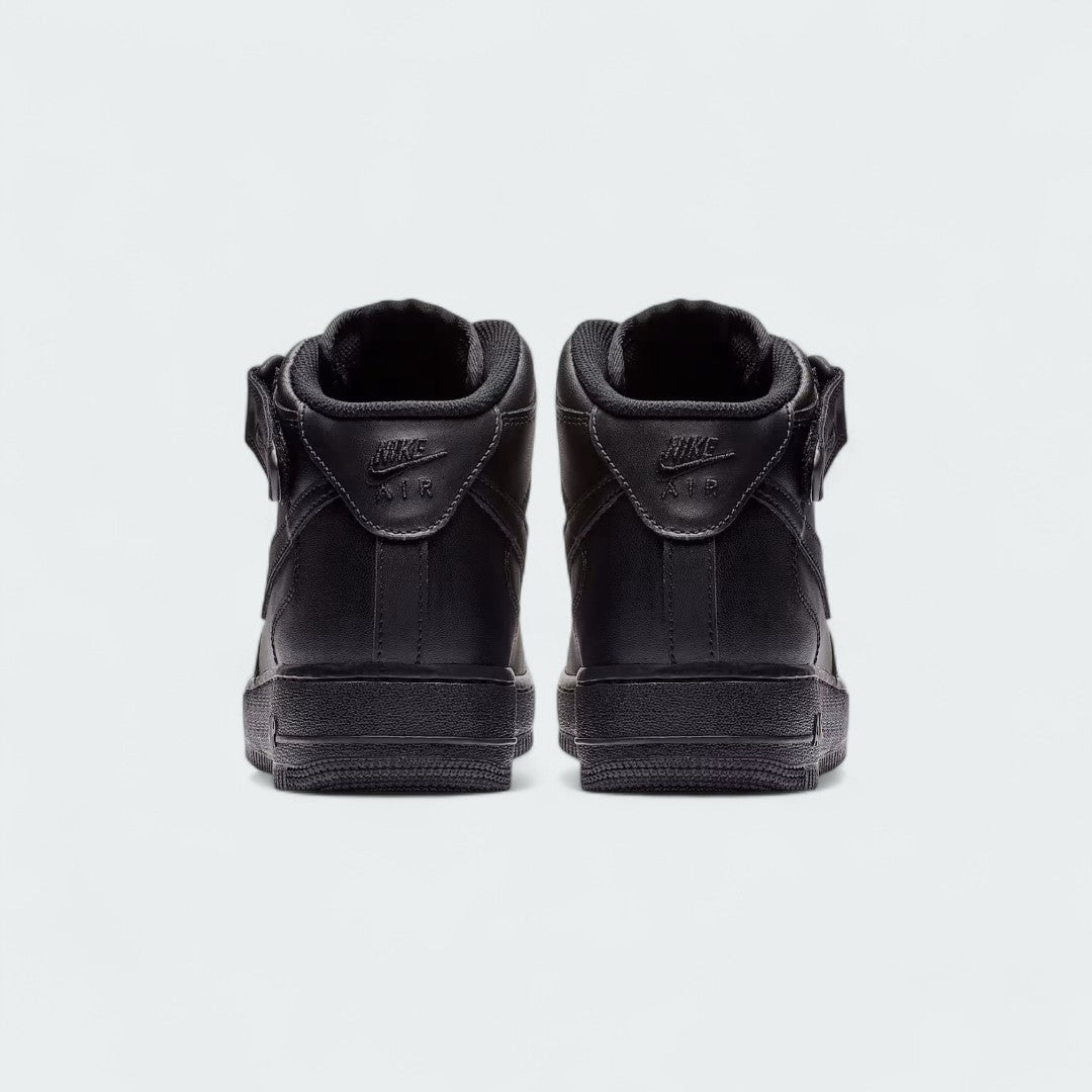 Rear view of the Nike Air Force 1 Mid '07 Men's black trainers, focusing on the heel panel and Nike Air branding.