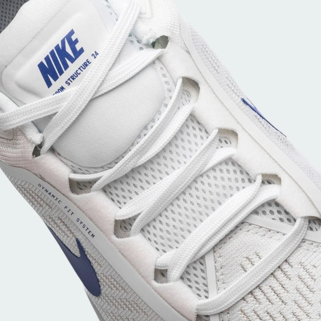 Close-up zoom on the front of the Nike Air Zoom Structure 24 Men's white running shoes, showing the breathable engineered mesh texture and integrated lacing system.