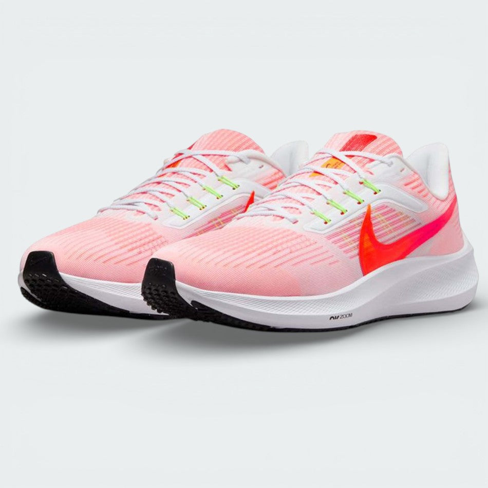 Angled shot of both Nike Pegasus 39 trainers side by side, showcasing the aerodynamic shape and vibrant orange detailing.