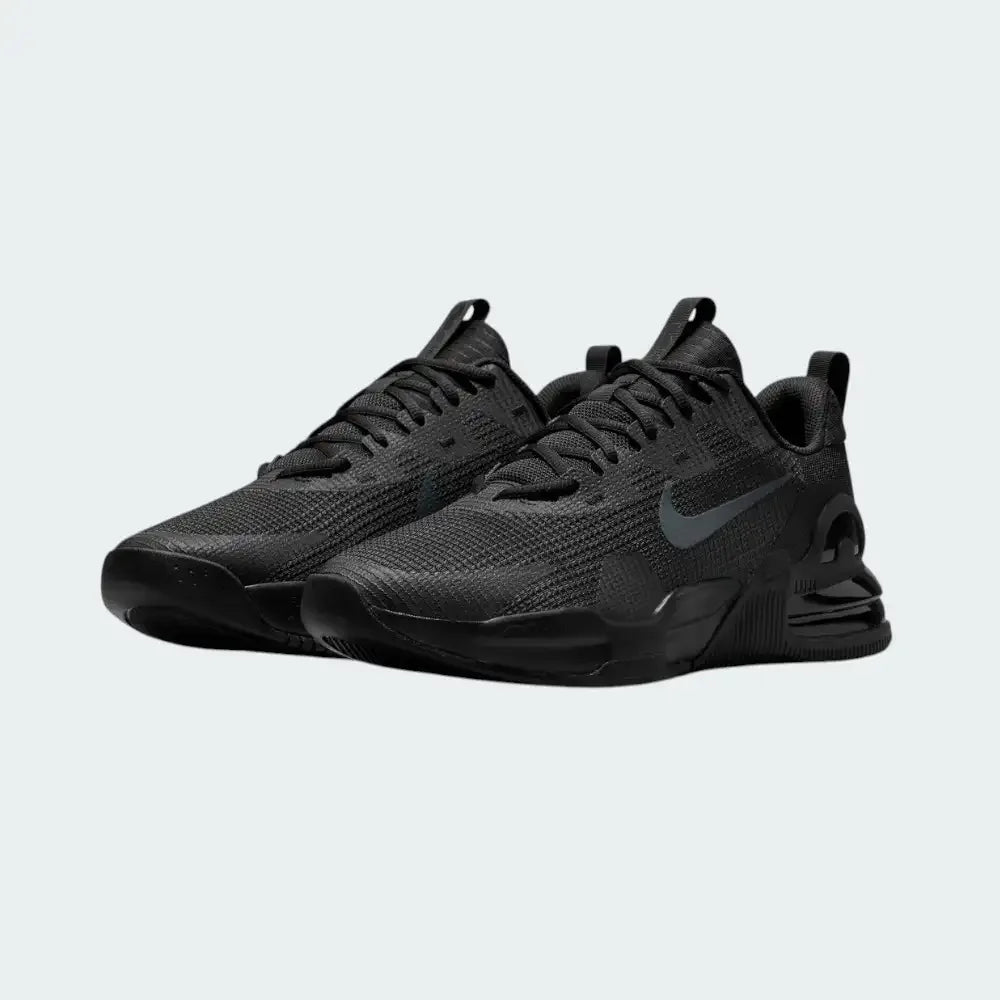 Angled view of two Nike Air Max Alpha Trainer 5 Men's black and grey shoes, side by side, showcasing their robust design and stable platform.